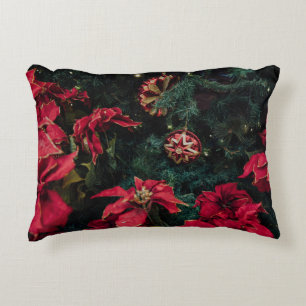 SELECTIVE FOCUS PHOTOGRAPHY OF RED POINSETTIA PLAN DECORATIVE CUSHION