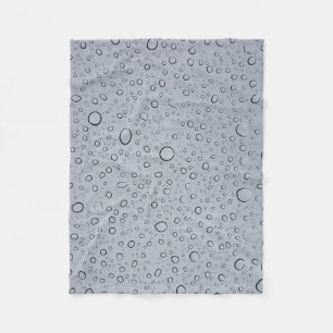 Selective focus photography of water droplets fleece blanket