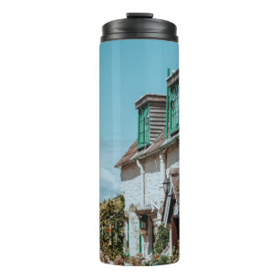 SELECTIVE FOCUS PHOTOGRAPHY OF WHITE AND BROWN CON THERMAL TUMBLER