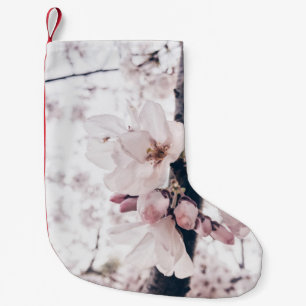 SELECTIVE FOCUS PHOTOGRAPHY OF WHITE AND PINK PETA SMALL CHRISTMAS STOCKING