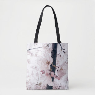 SELECTIVE FOCUS PHOTOGRAPHY OF WHITE AND PINK PETA TOTE BAG