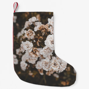 SELECTIVE FOCUS PHOTOGRAPHY OF WHITE PETALED FLOWE SMALL CHRISTMAS STOCKING