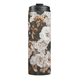 SELECTIVE FOCUS PHOTOGRAPHY OF WHITE PETALED FLOWE THERMAL TUMBLER