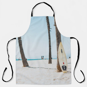 Selective focus photography of white surfboard apron