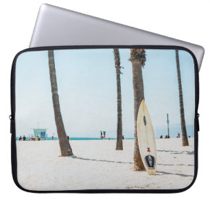 Selective focus photography of white surfboard laptop sleeve