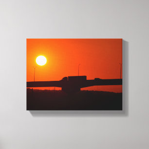 Semi truck going over bridge sunset canvas print