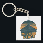 Serene Mountain Sunrise Retro Emblem Key Ring<br><div class="desc">♾️This serene emblem captures the stillness of morning light behind a mountain. Designed in a retro aesthetic,  it's ideal for nature enthusiasts,  campers,  and anyone drawn to peaceful landscapes.💟</div>
