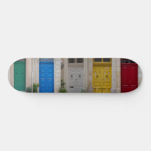 Set of colourful front doors in Malta Skateboard