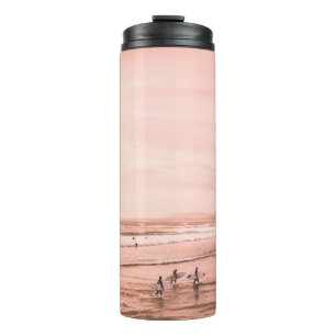 SEVERAL PEOPLE STANDING ON SEASHORE THERMAL TUMBLER