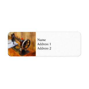 Sewing Machine With Orange Thread Return Address Label