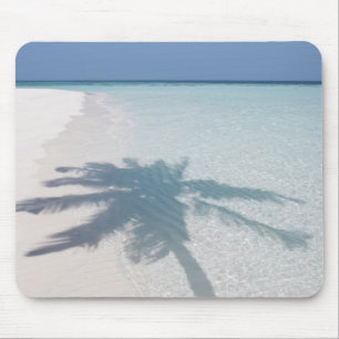 Shadow of a palm tree on a deserted island beach mouse pad