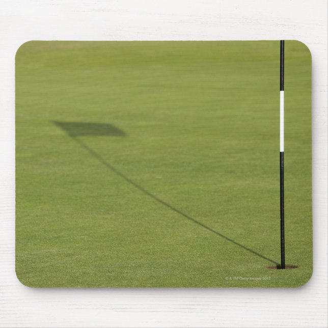shadow of golf flag on golf course green mouse pad (Front)