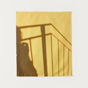 Shadow of man near stair tapestry