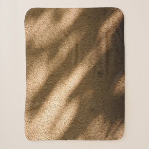 Shadow on brown carpeted floor sherpa blanket