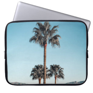 Shallow focus photo of palm trees in the morning laptop sleeve