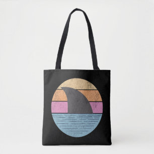 Shark at sunset tote bag