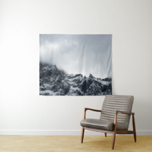 Sharp edges of mountains and soft clouds tapestry