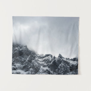 Sharp edges of mountains and soft clouds tapestry