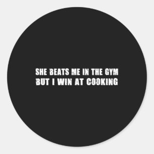 She Beats Me In The Gym But I Win At Cooking Funny Classic Round Sticker