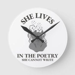 SHE LIVES IN THE POETRY SHE CANNOT WRITE ROUND CLOCK