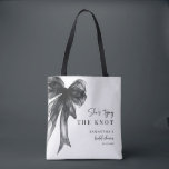 She’s Tying The Knot Black Bow Bridal Shower Tote Bag<br><div class="desc">Celebrate the bride-to-be with this She’s Tying The Knot Black Bow Bridal Shower Tote Bag, designed with a chic coquette-inspired black bow and elegant modern typography. Perfect for bridal showers, bachelorette celebrations, and wedding events, this stylish tote makes a thoughtful gift for the bride, bridesmaids, or guests. Ideal as a...</div>