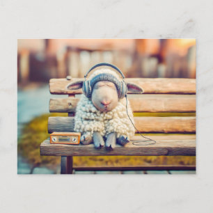 Sheep napping with headphones bench holiday postcard