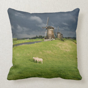 Sheep with windmills under dark clouds cushion