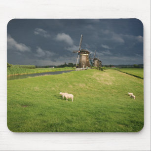 Sheep with windmills under dark clouds mouse pad