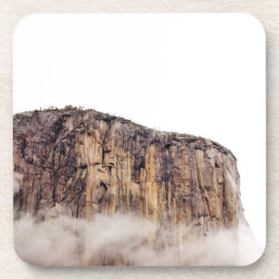 Sheer cliff rising above clouds coaster
