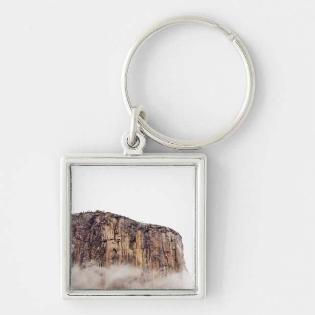 Sheer cliff rising above clouds key ring (Front)