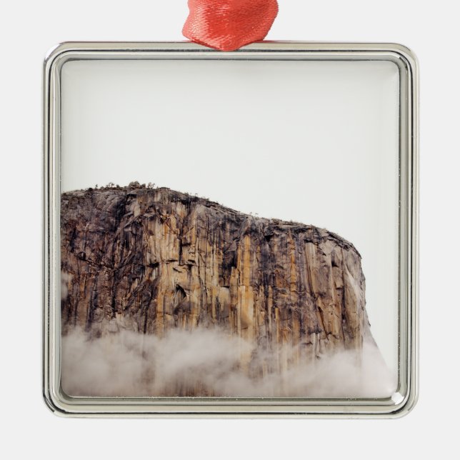 Sheer cliff rising above clouds metal tree decoration (Front)