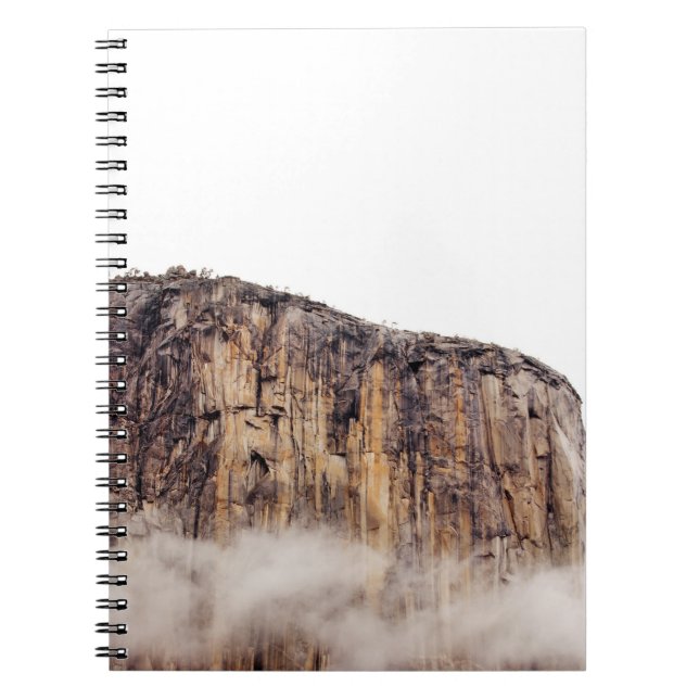 Sheer cliff rising above clouds notebook (Front)