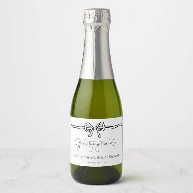 She's Tying The Knot Modern Script Bridal Shower Sparkling Wine Label (Front)