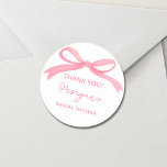 She's Tying The Knot Pink Bow Bridal Shower Classic Round Sticker<br><div class="desc">Celebrate the bride-to-be with our "She's Tying The Knot" Pink Bow Bridal Shower Classic Sticker. Featuring a soft blush pink background and an elegant bow design, these stickers add a charming touch to any bridal shower. Perfect for sealing invitations, embellishing favour bags, or decorating party accessories, they offer a stylish...</div>