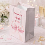 She's tying the knot pink bow Bridal Shower Medium Gift Bag<br><div class="desc">A blush pink background decorated with a pink coloured bow. Personalise and add a name
Text: She's tying the knot.</div>