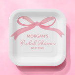 She's Tying The Knot Pink Bow Bridal Shower Paper Plate<br><div class="desc">Celebrate the bride-to-be with our "She's Tying The Knot" Pink Bridal Shower Paper Plates. Featuring a beautiful blush pink background with elegant script and a charming bow design, these plates add a sophisticated touch to your bridal shower decor. Made from high-quality, durable paper, they are perfect for serving appetizers, desserts,...</div>