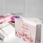 She's tying the knot pink bow floral Bridal Shower Large Gift Bag<br><div class="desc">Blush pink background decorated with a pink coloured bow and pink roses,  flowers. Personalise and add a name
Text: She's tying the knot.</div>