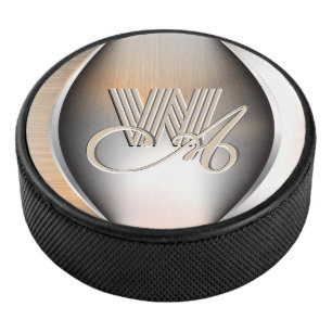 Shining brushed steel monogram hockey puck