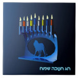 Shiny Blue Chanukkah Menorah Ceramic Tile<br><div class="desc">A modernistic,  metallic,  blue Chanukkah menorah,  featuring a lion in silhouette,  against a dark,  night-like background. All nine of the candles are lit. Hebrew text reading "Chag Chanukkah Sameach" (Happy Hanukkah) also appears in glowing blue and white.</div>