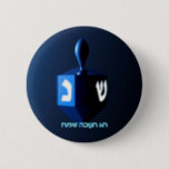 Shiny Blue Dreidel 6 Cm Round Badge<br><div class="desc">A modernistic,  metallic blue dreidel against a dark,  night-like background.  Two of the Hebrew letters found on a dreidel,  nun and shin,  glow brightly.  Hebrew text reading "Chag Chanukkah Sameach" (Happy Hanukkah) also appears in glowing blue and white.</div>