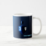 Shiny Blue Dreidel Coffee Mug<br><div class="desc">A modernistic,  metallic blue dreidel against a dark,  night-like background.  Two of the Hebrew letters found on a dreidel,  nun and shin,  glow brightly.  Hebrew text reading "Chag Chanukkah Sameach" (Happy Hanukkah) also appears in glowing blue and white.</div>