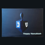 Shiny Blue Dreidel Placemat<br><div class="desc">A modernistic,  metallic blue dreidel against a dark,  night-like background.  Two of the Hebrew letters found on a dreidel,  nun and shin,  glow brightly.  Text reading "Happy Hanukkah" also appears in glowing blue and white.</div>