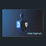 Shiny Blue Dreidel Placemat<br><div class="desc">On the front a modernistic, metallic blue dreidel against a dark, night-like background. Two of the Hebrew letters found on a dreidel, nun and shin, glow brightly. Hebrew text reading "Chag Chanukkah Sameach" (Happy Hanukkah) also appears in glowing blue and white. On the reverse side is the same image with...</div>
