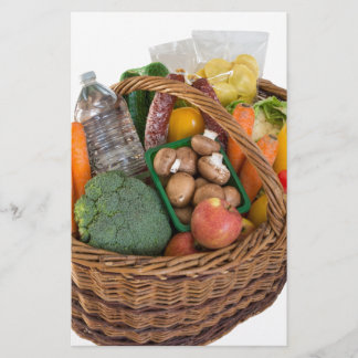 Shopping basket with foods fruits and vegetables stationery