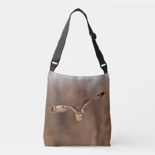 Short-eared owl diving towards the ground crossbody bag