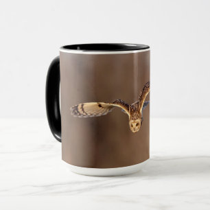 Short-eared owl diving towards the ground mug