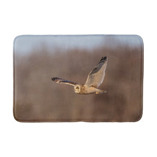 Short-eared owl in flight bath mat