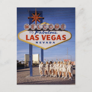 Showgirls in front of the historic Las Vegas sign Postcard