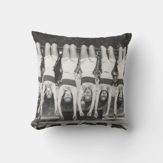 Showgirls on monkey bars, playful design. cushion