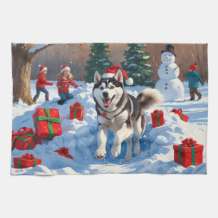 Siberian Husky Running in Snow with Christmas Hat Tea Towel